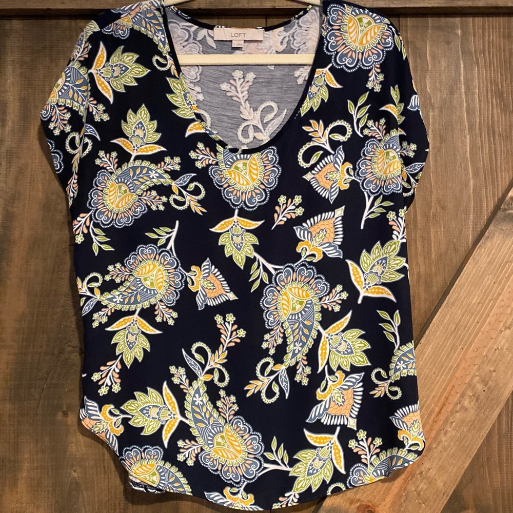 Size small Loft dressy short sleeve blouse. Color is navy with paisley design
